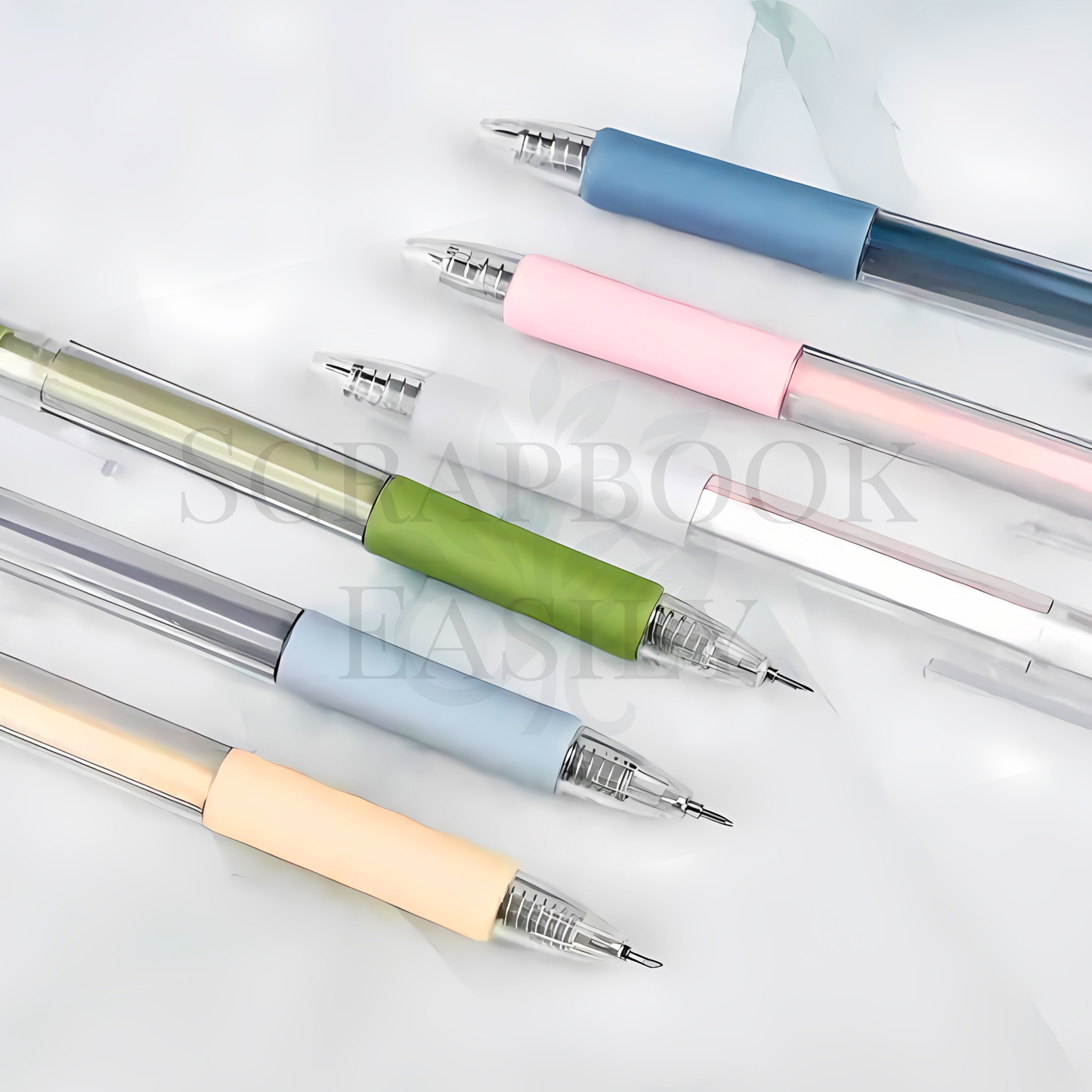 Collection of precision craft knife pens with retractable blades, displayed in pastel colours, perfect for detailed cutting in scrapbooking & crafting, available online from Scrapbook Easily.