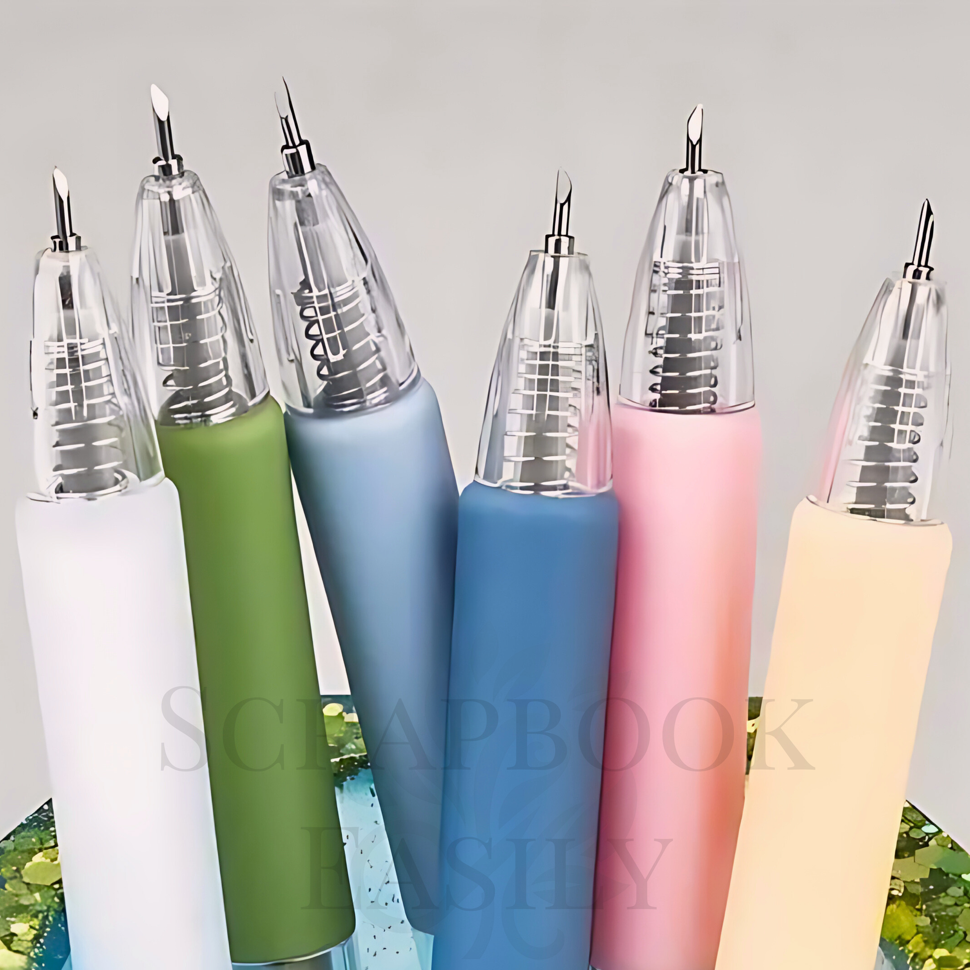 Close-up of a series of precision craft knife pens with fine-point blades, featured in shades of white, sage, blue, arctic storm, pink, & sunbeam, designed for detailed paper cutting in creative projects, buy from our Scrapbook Easily store.