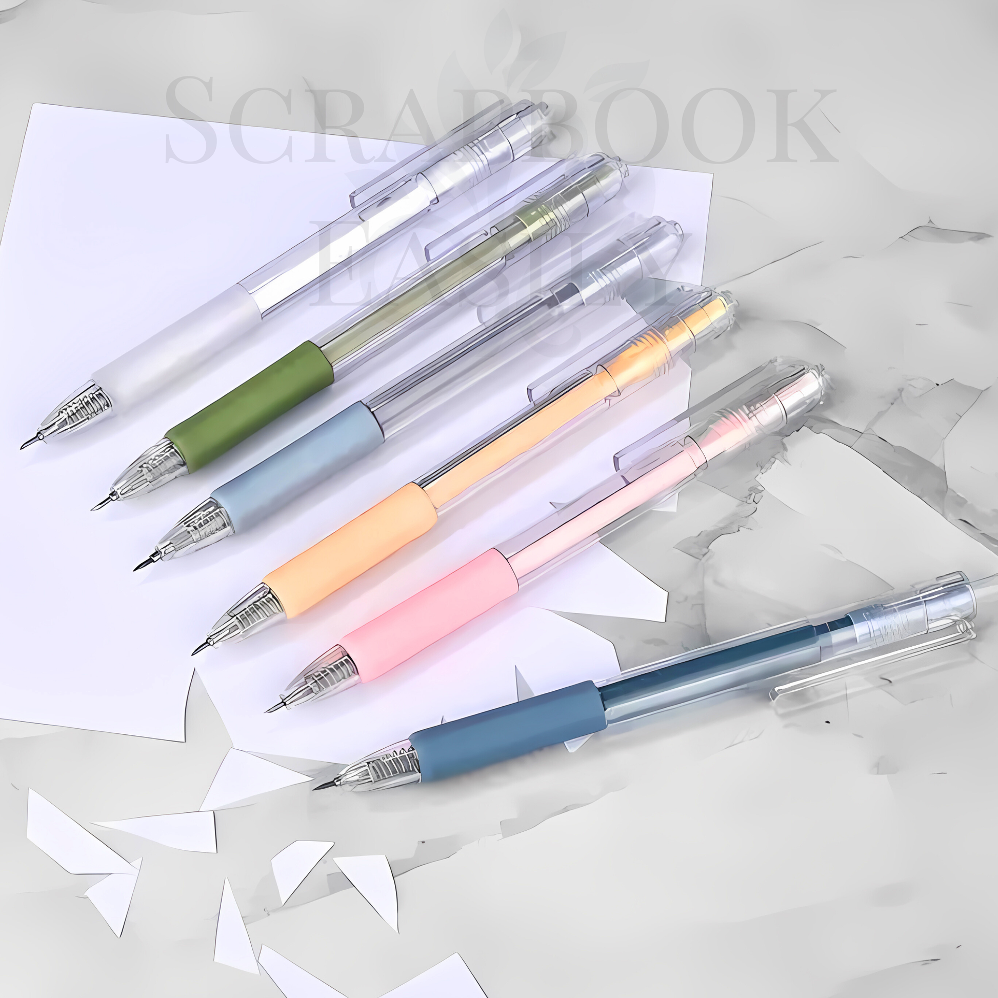 Elegant array of precision craft knife pens laid out with a white sheet of paper, featuring knives in colours of green, blue, sunbeam, & pink, ideal for detailed scrapbooking & crafting, buy from our online scrapbooking store.