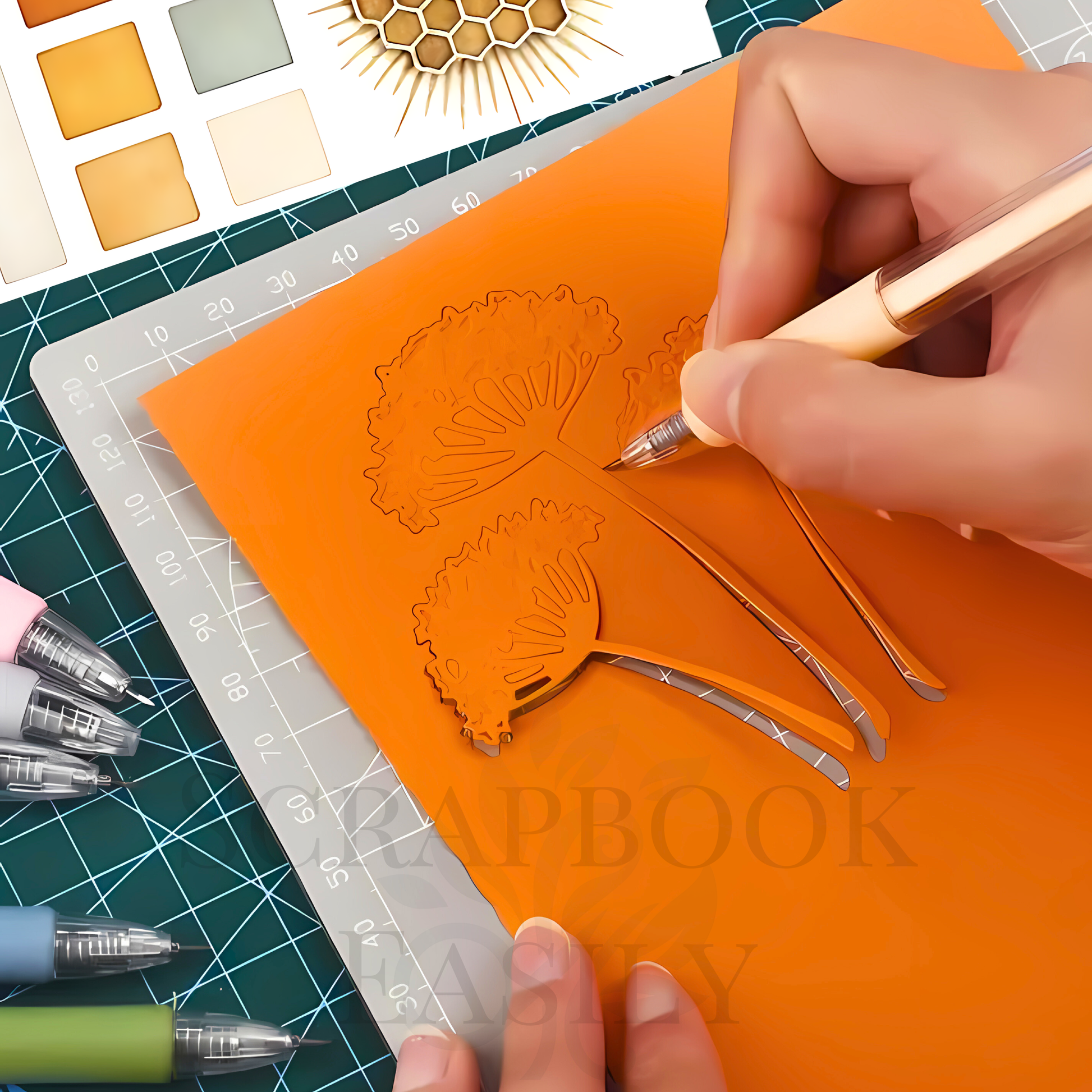 Detailed view of using a precision craft knife pen in sunbeam, intricately cutting out a floral design on orange paper, displayed on a cutting mat with a collection of other craft knife pens & scrapbooking materials, perfect for creative paper crafting, buy online from Scrapbook Easily.